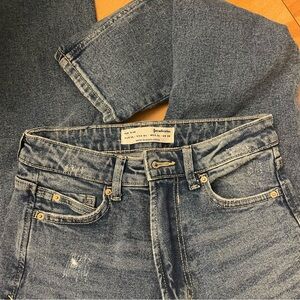 Stradivarius distressed blue denim slim jeans in a size US 4